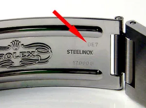 Inside of a Rolex clasp, a red arrow points at the clasp code next to STEELINOX