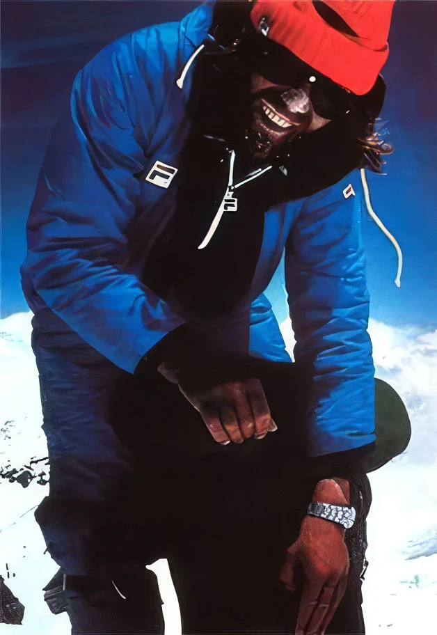 Reinhold Messner in a blue jacket and red cap with the Rolex Oysterquartz on his wrist