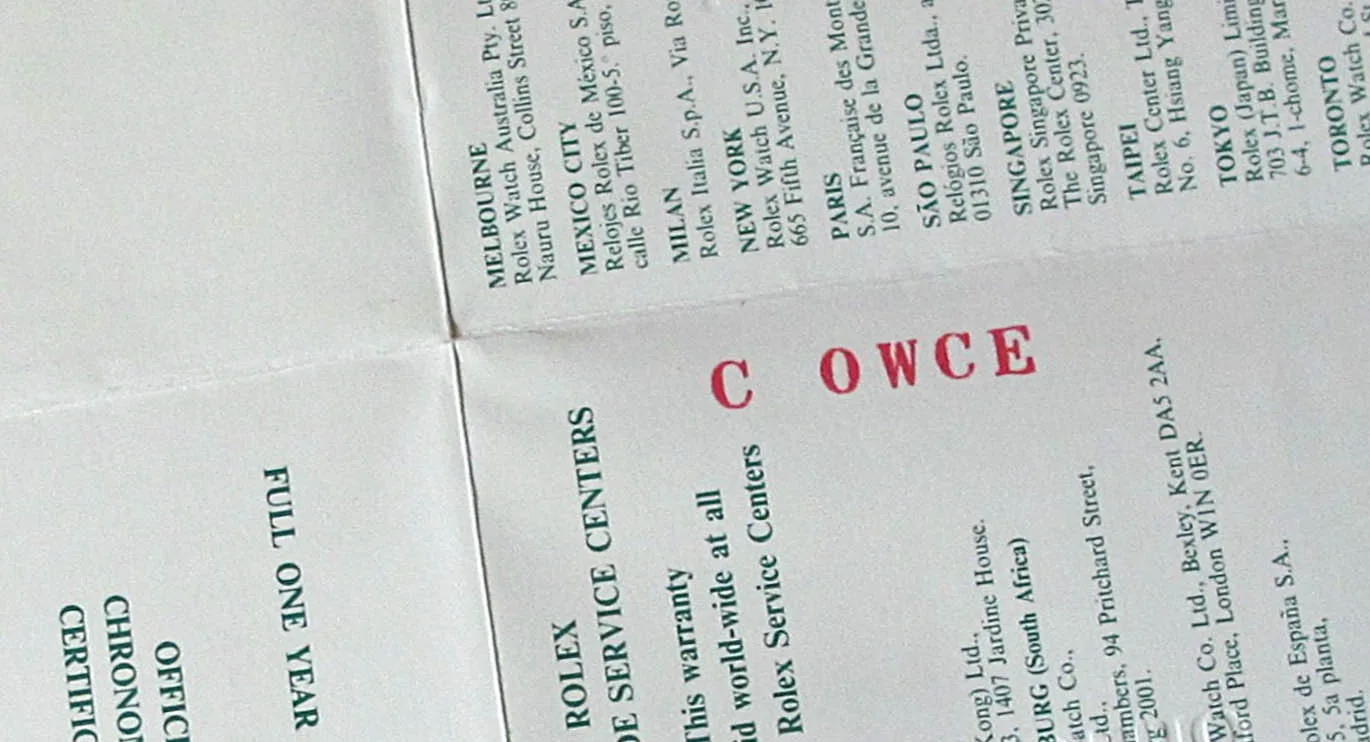Back of a Rolex certificate with the red letter code C OWCE